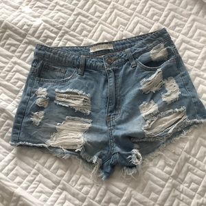 On trend distressed boutique denim shorts